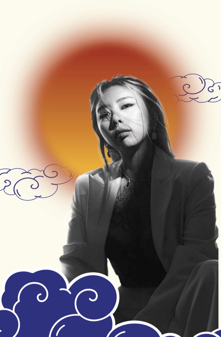 Portrait of Nicole Trang against a sunset-orange sun and indigo clouds